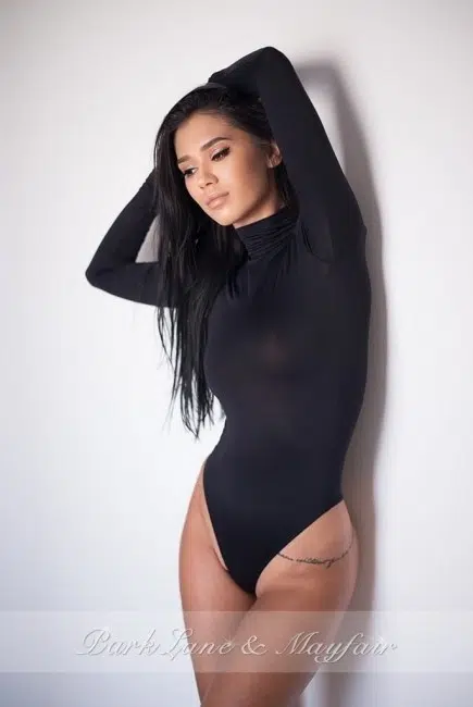 Naughty escort Carla in her black bodysuit
