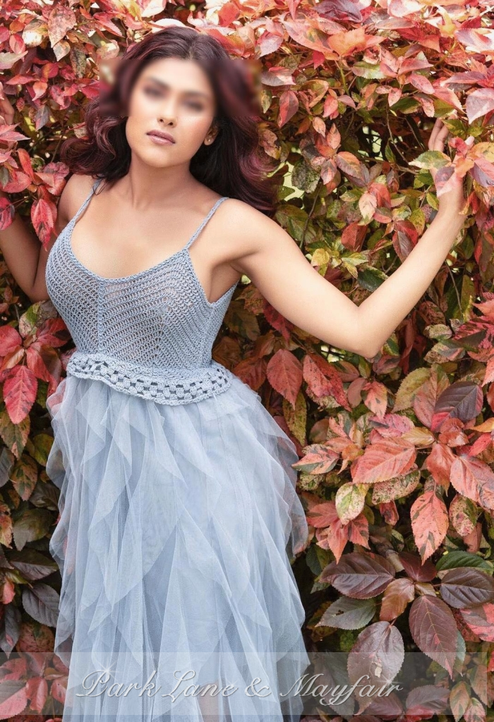Beautiful escort Ruby showing off her sexy physique in the garden