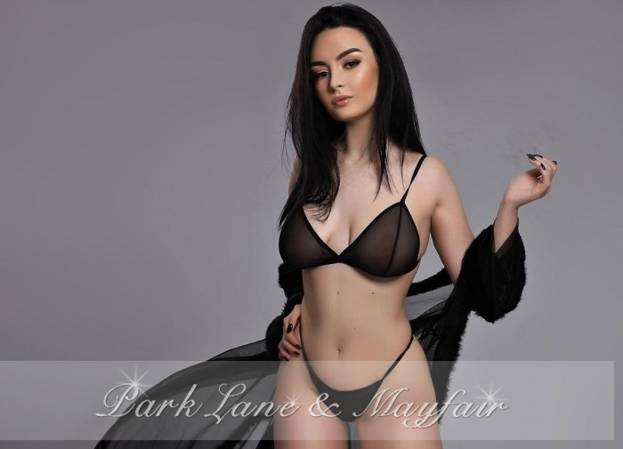 Suzie in a photoshoot showing off her tightly toned body