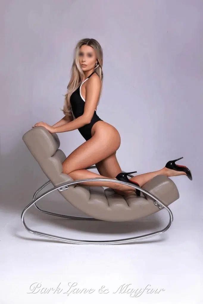 A beautiful escort in a seductive outfit, radiating confidence and elegance.