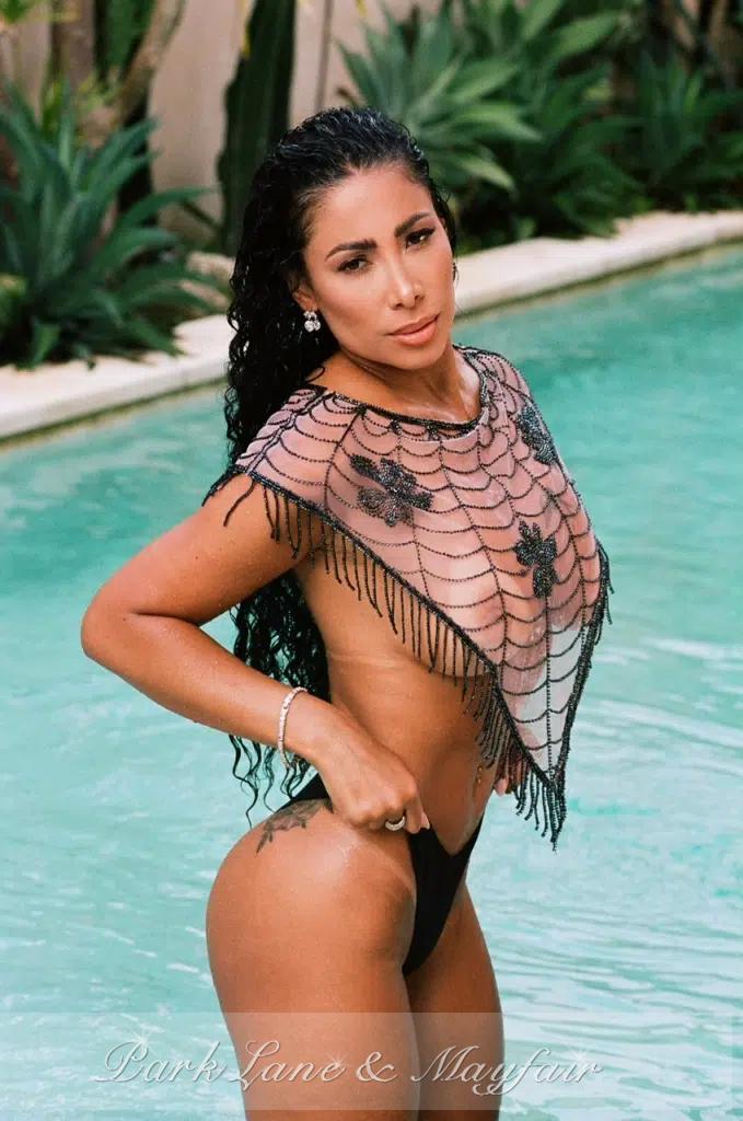 Harmony gently showcases her graceful, curvy figure from a lovely side view.