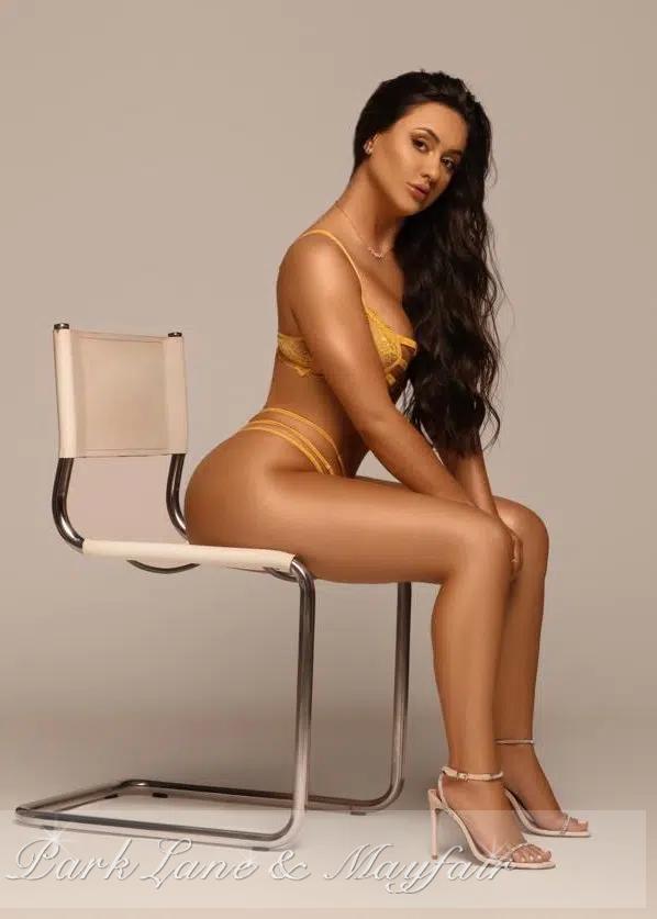 Louisa gently showcased her beautifully long and toned legs.