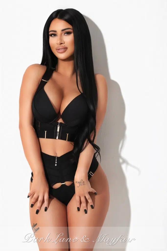 Mimi gently displays a beautiful side view of her lovely, curvy figure.