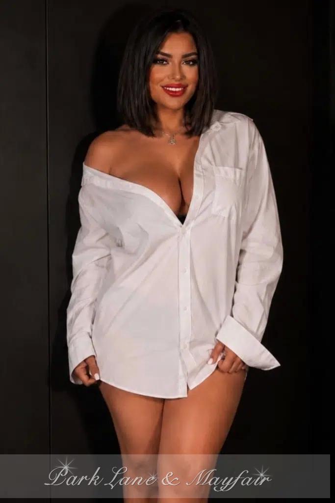 Paulina radiates charm as she confidently showcases her natural beauty.