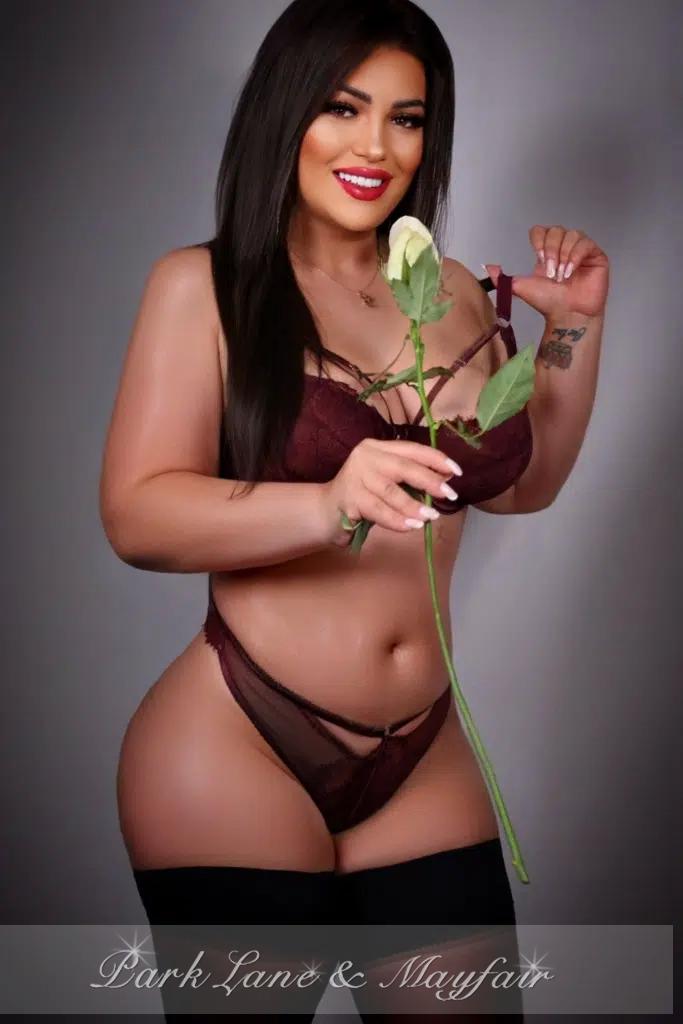 Paulina charms with her captivating pose and her radiant eyes that draw you in.