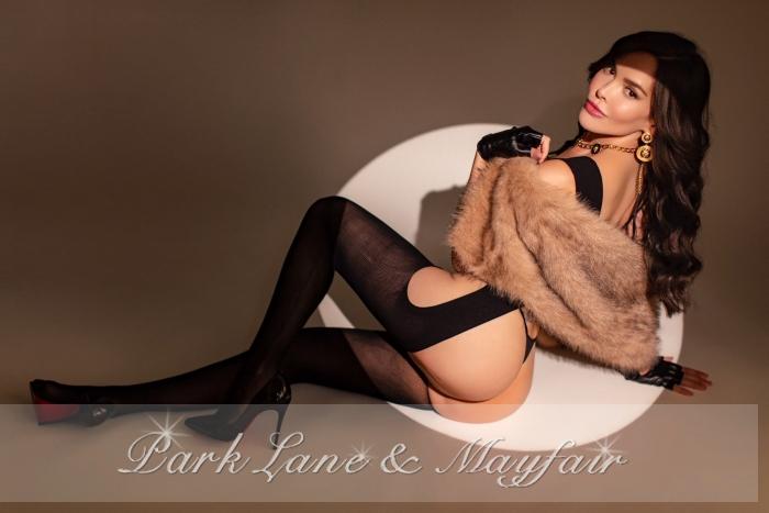 A captivating escort radiating grace in her stunning gallery images.