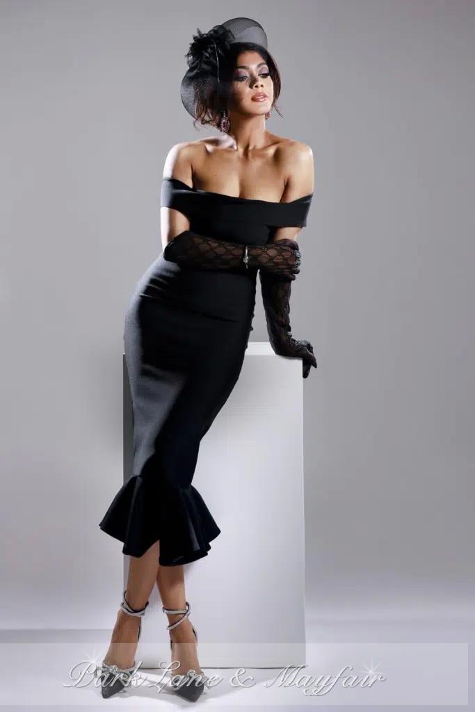 Sabrina radiates charm as she proudly showcases her natural beauty.