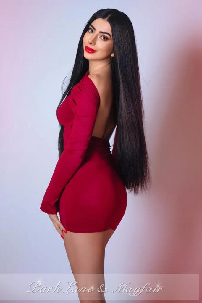 Wendelin wears a sexy outfit that highlights her fun-loving character.